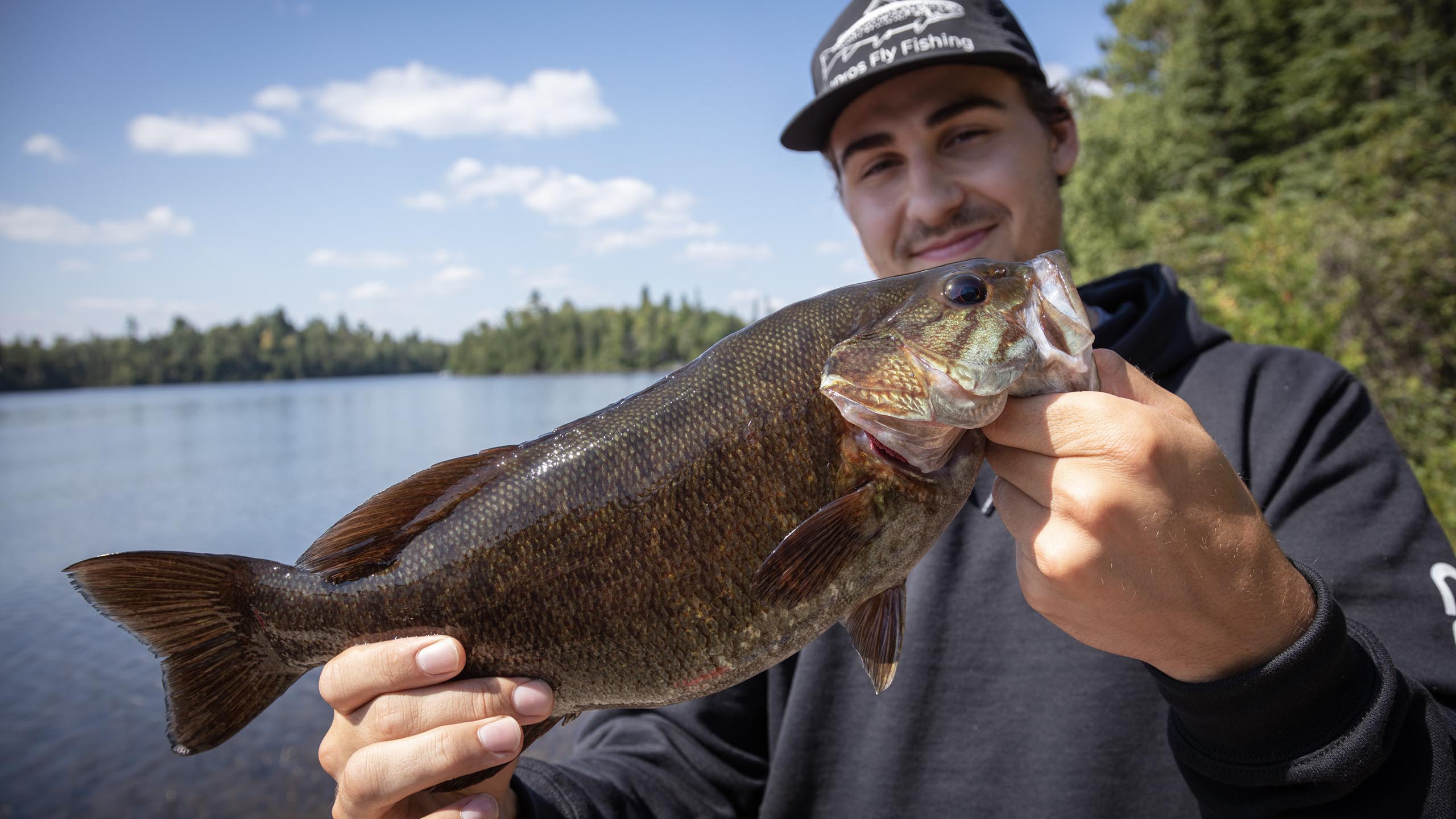 man holding fish smallmouth boundary waters bwca lake