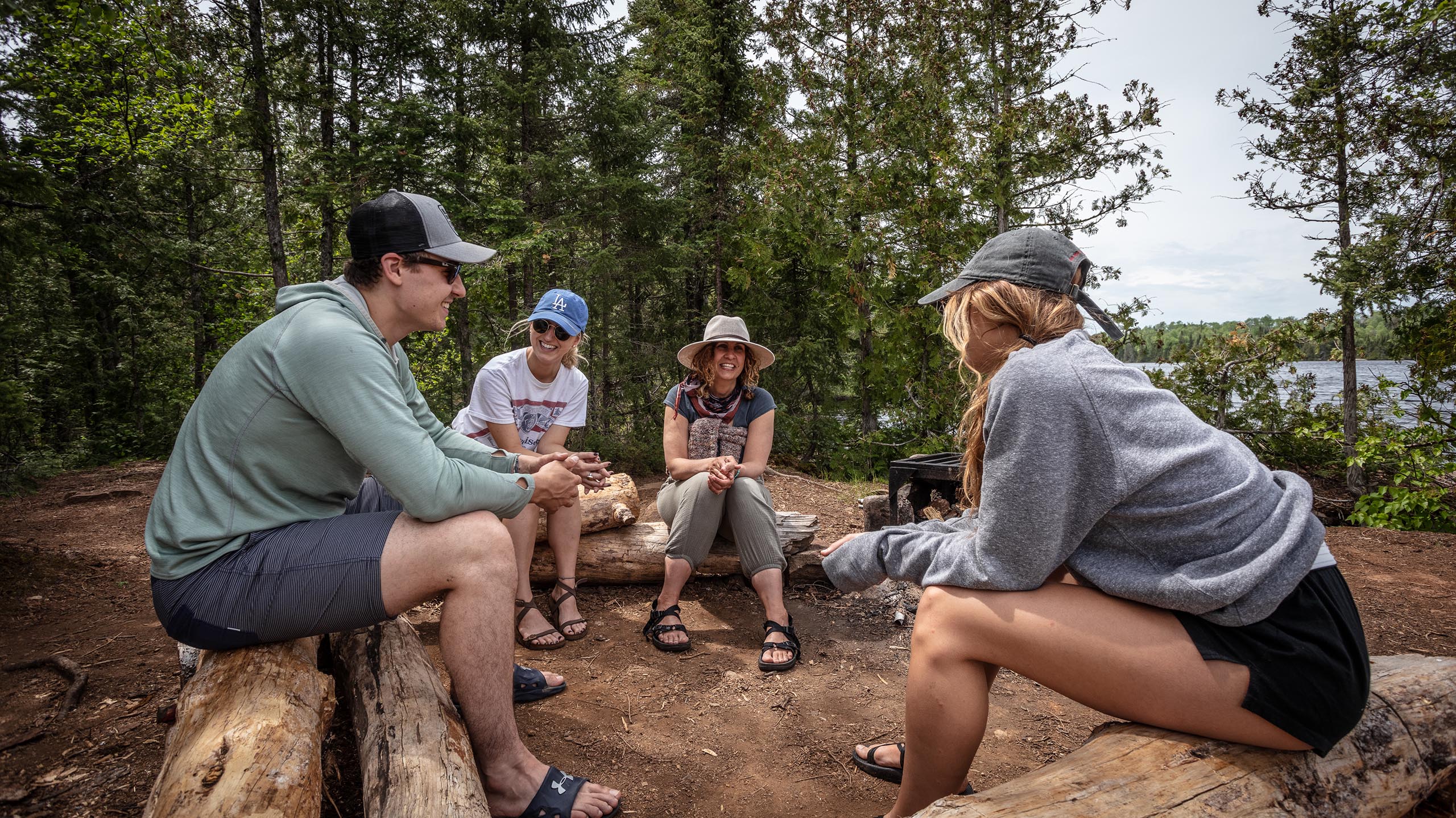 four people at a boundary waters campsite