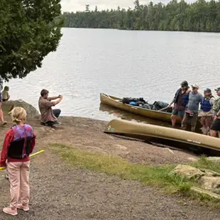 Rockwood--Rockwood Lodge and Outfitters 13 Group photo canoe on the beach of rockwood outfitters